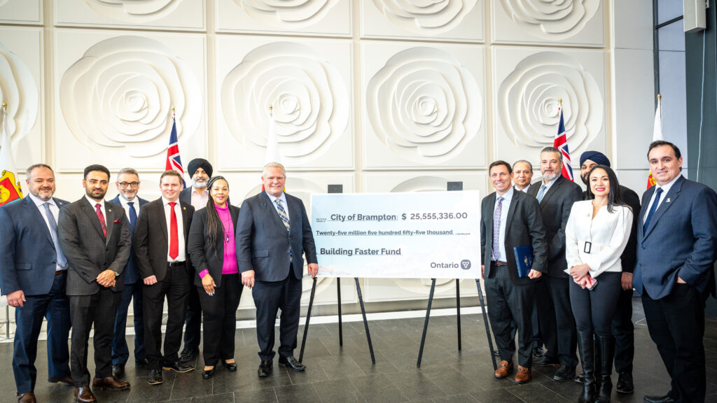 Group photo at Brampton event with check presentation for Building Faster Fund by Ontario officials.